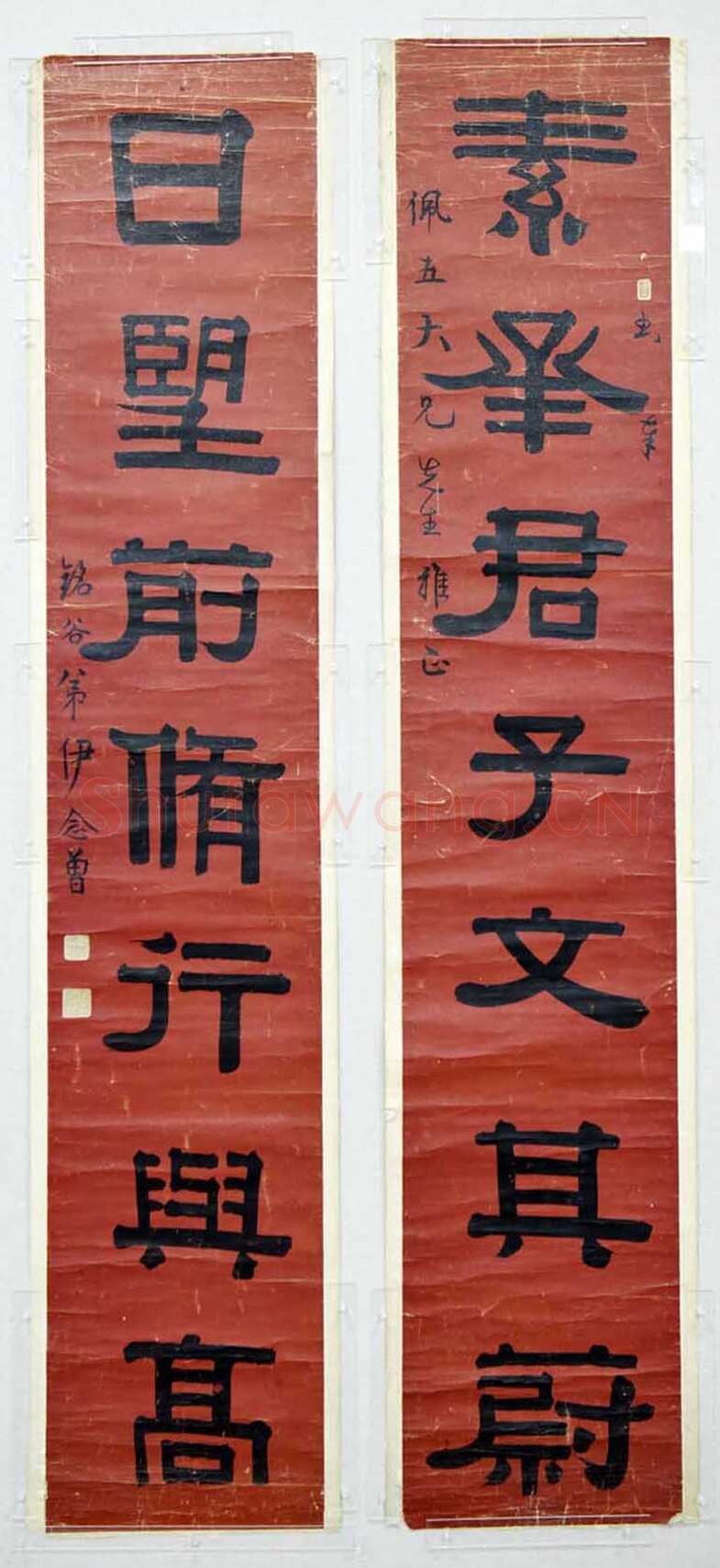 伊念曾《隶书素承日望七言联》